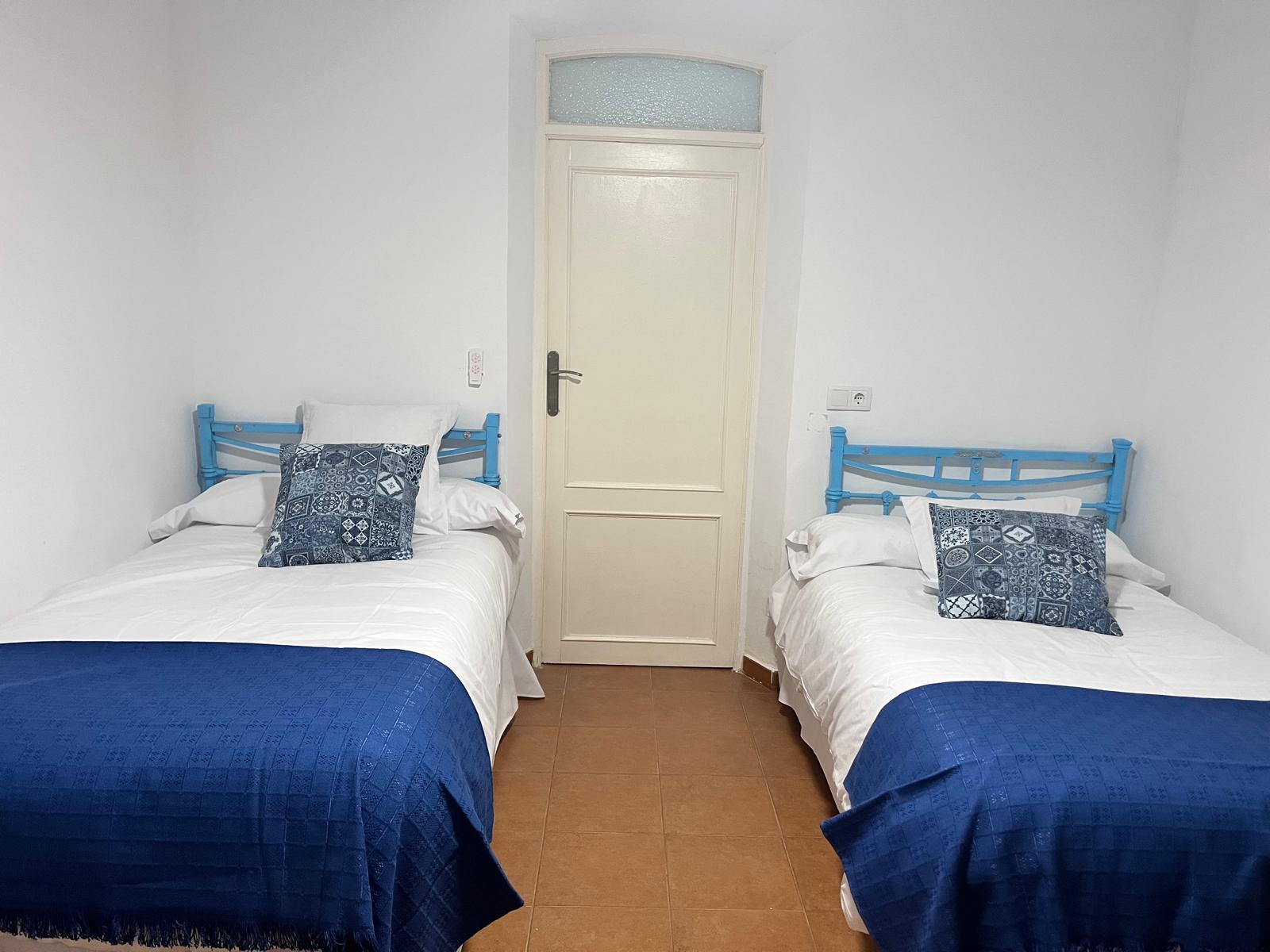 Dormitorio con dos camas en Casa Eufemia